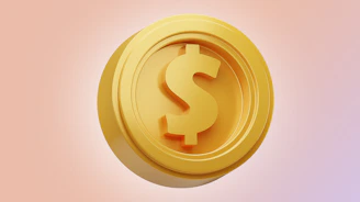 a golden button with a dollar sign on it