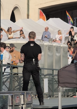 a police officer standing in front of a crowd of people