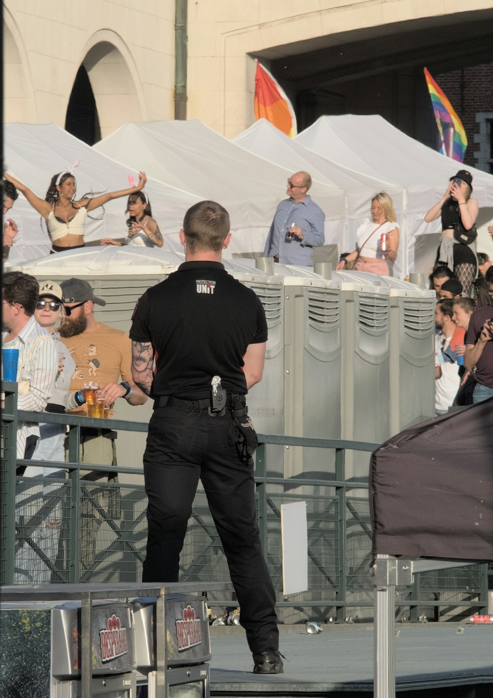 a police officer standing in front of a crowd of people