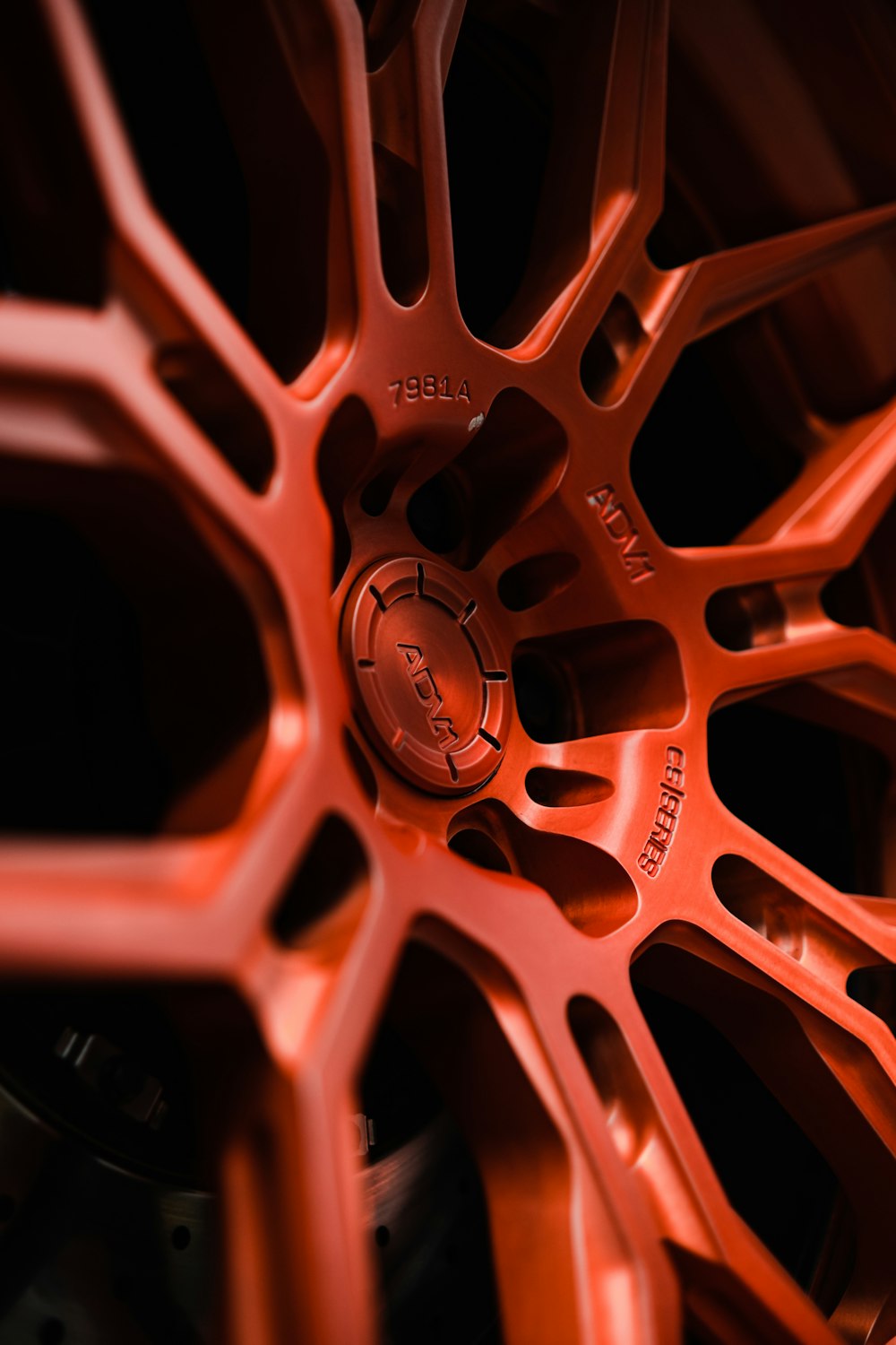 a close up of a red wheel on a vehicle