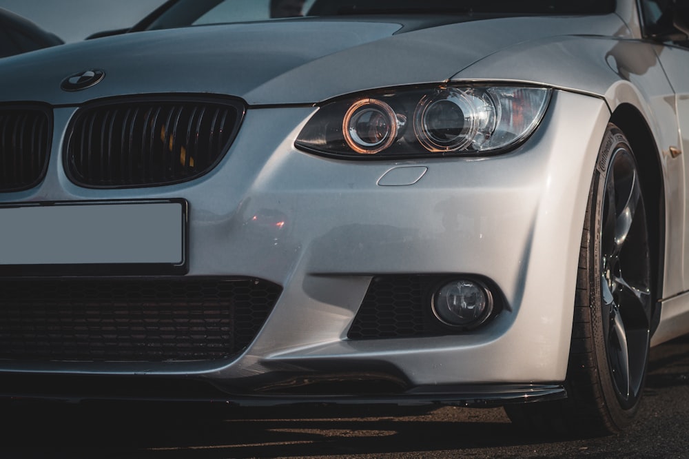 a close up of the front of a white car