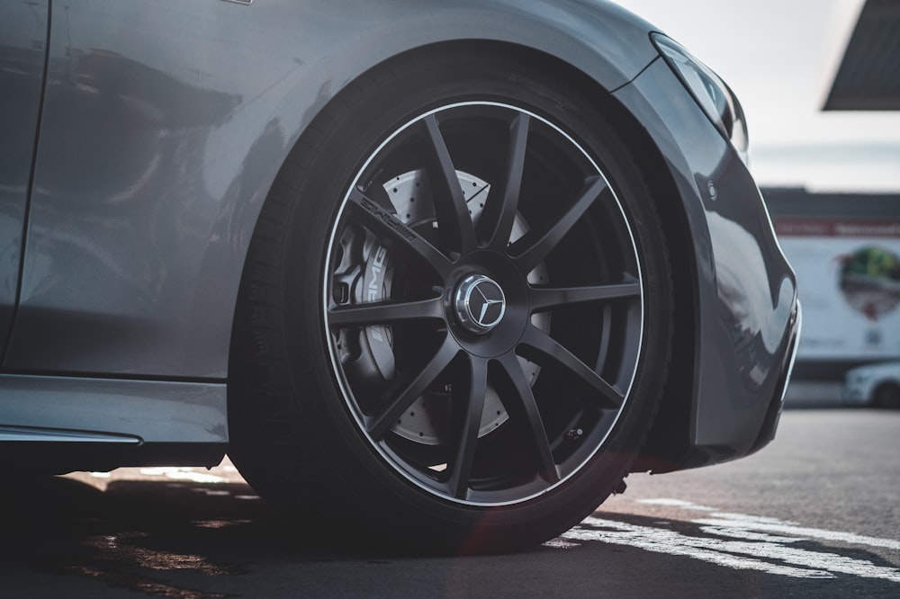 a close up of a car tire on a street