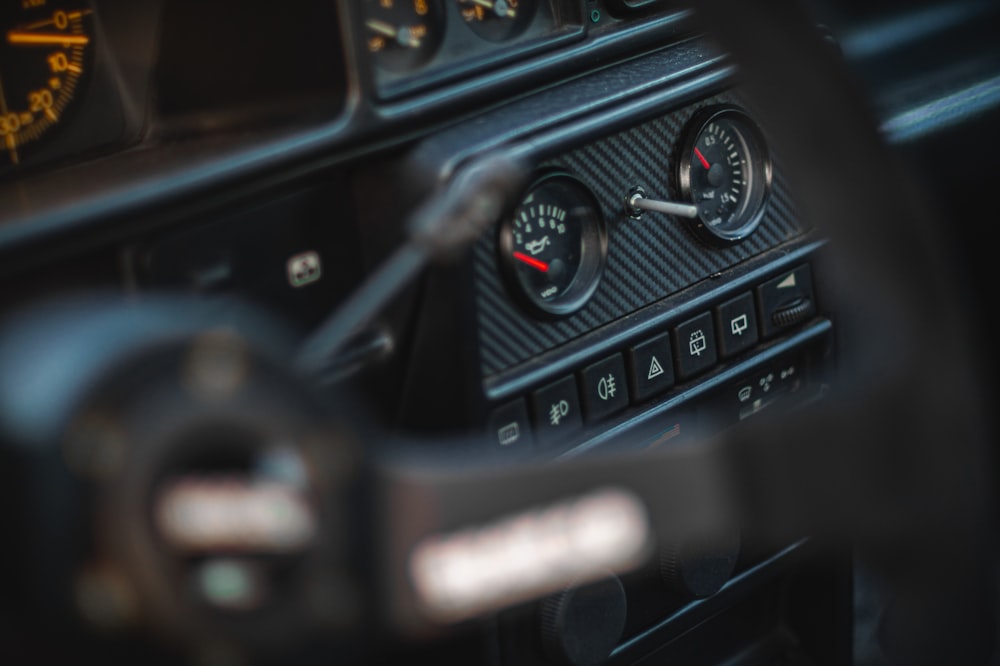 the dashboard of a car with a speedometer and gauges