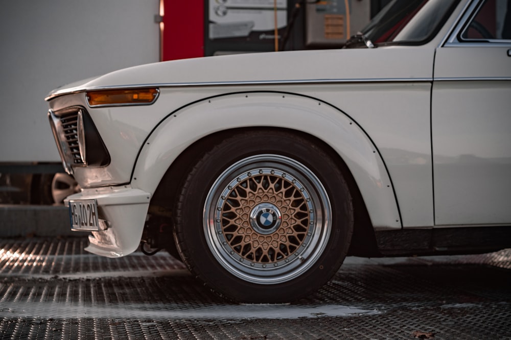 a white car parked in a parking lot