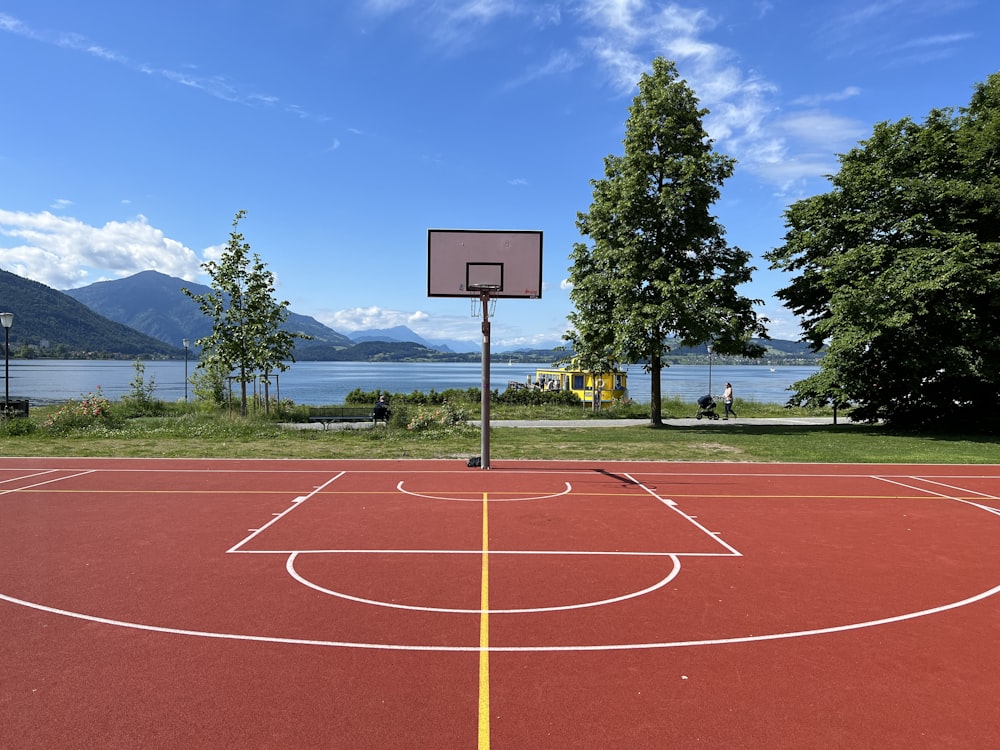 a basketball court with a basketball hoop in the middle of it