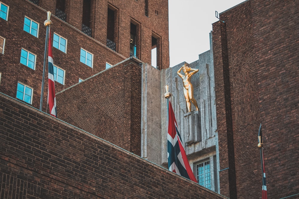 a statue of a man on top of a building