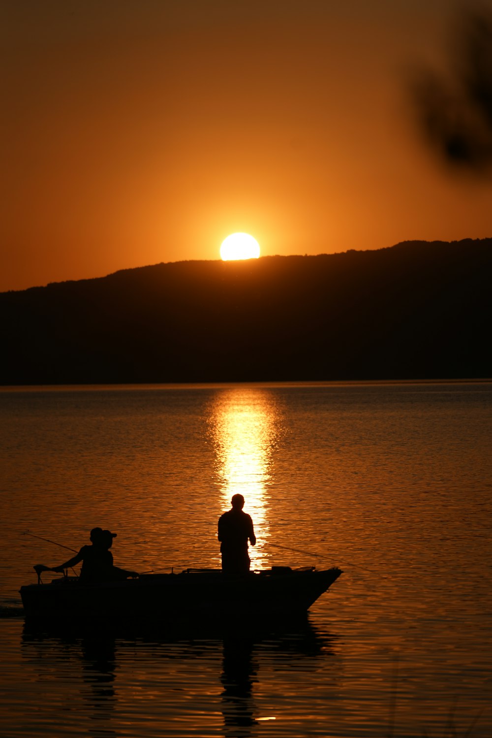 a couple of people on a boat in the water