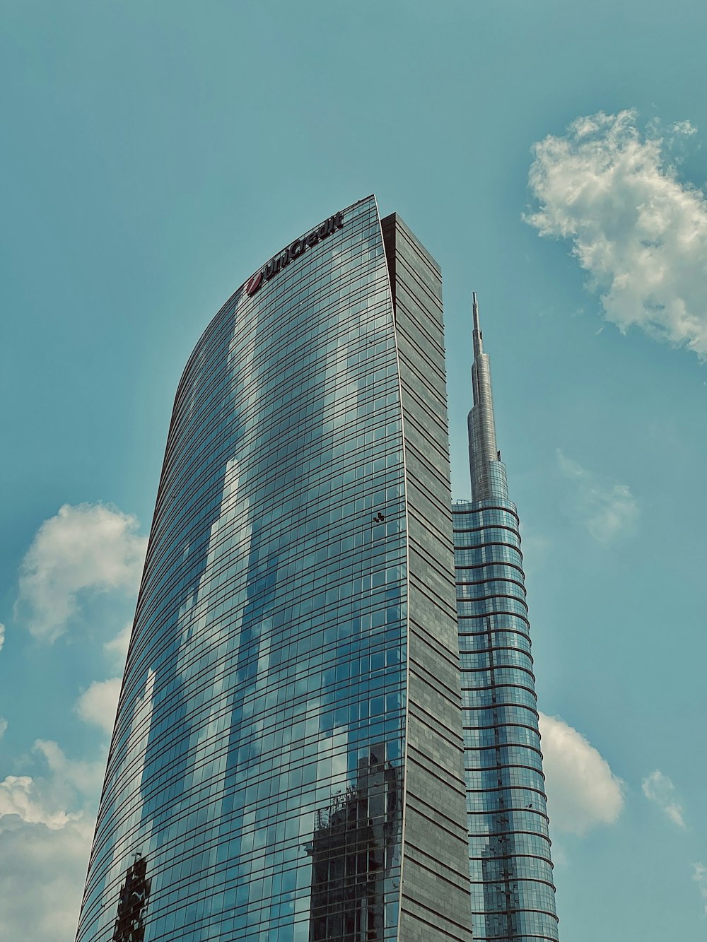 a very tall building with a sky background