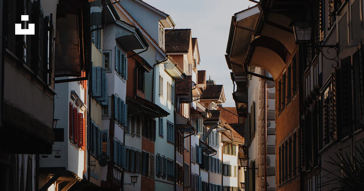 A narrow street with several buildings on both sides photo – Free ...