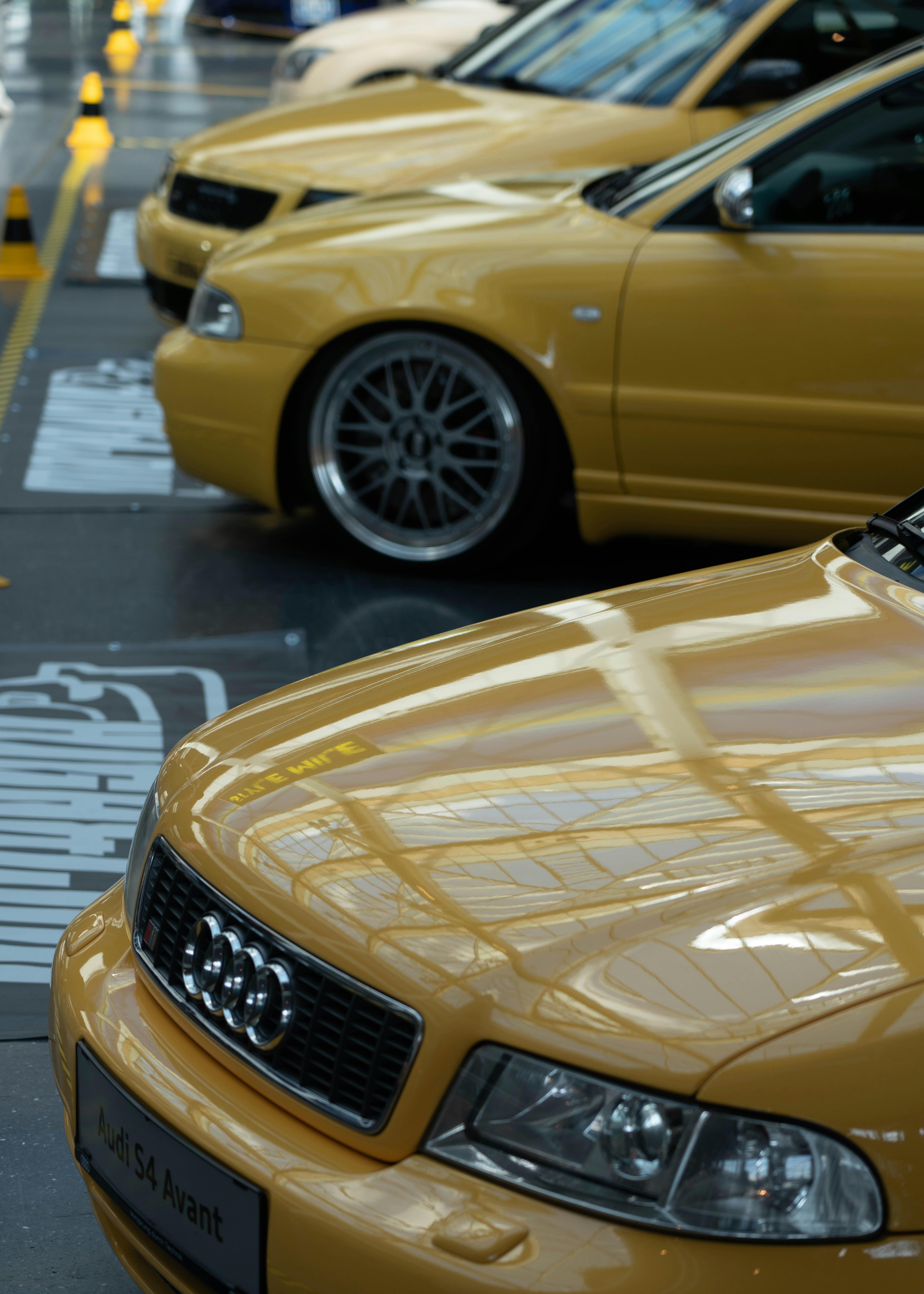 a row of parked cars on a wet street