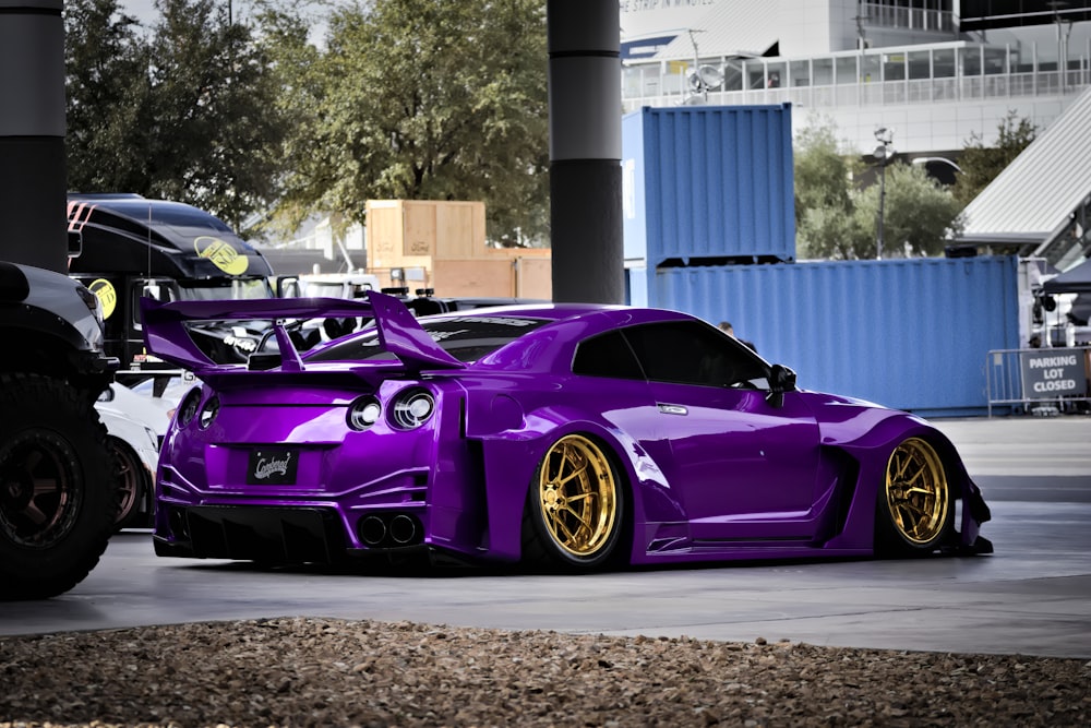 a purple sports car parked in a parking lot