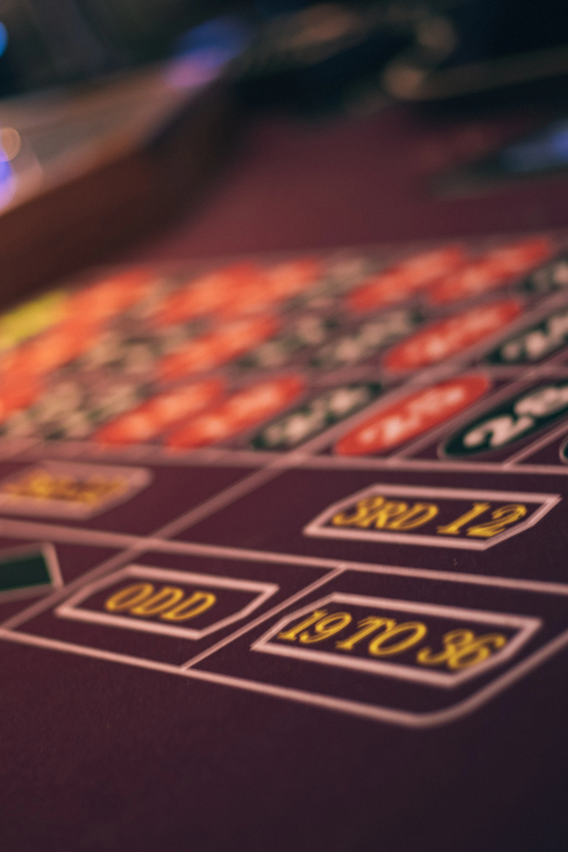 A craps table layout under casino lights