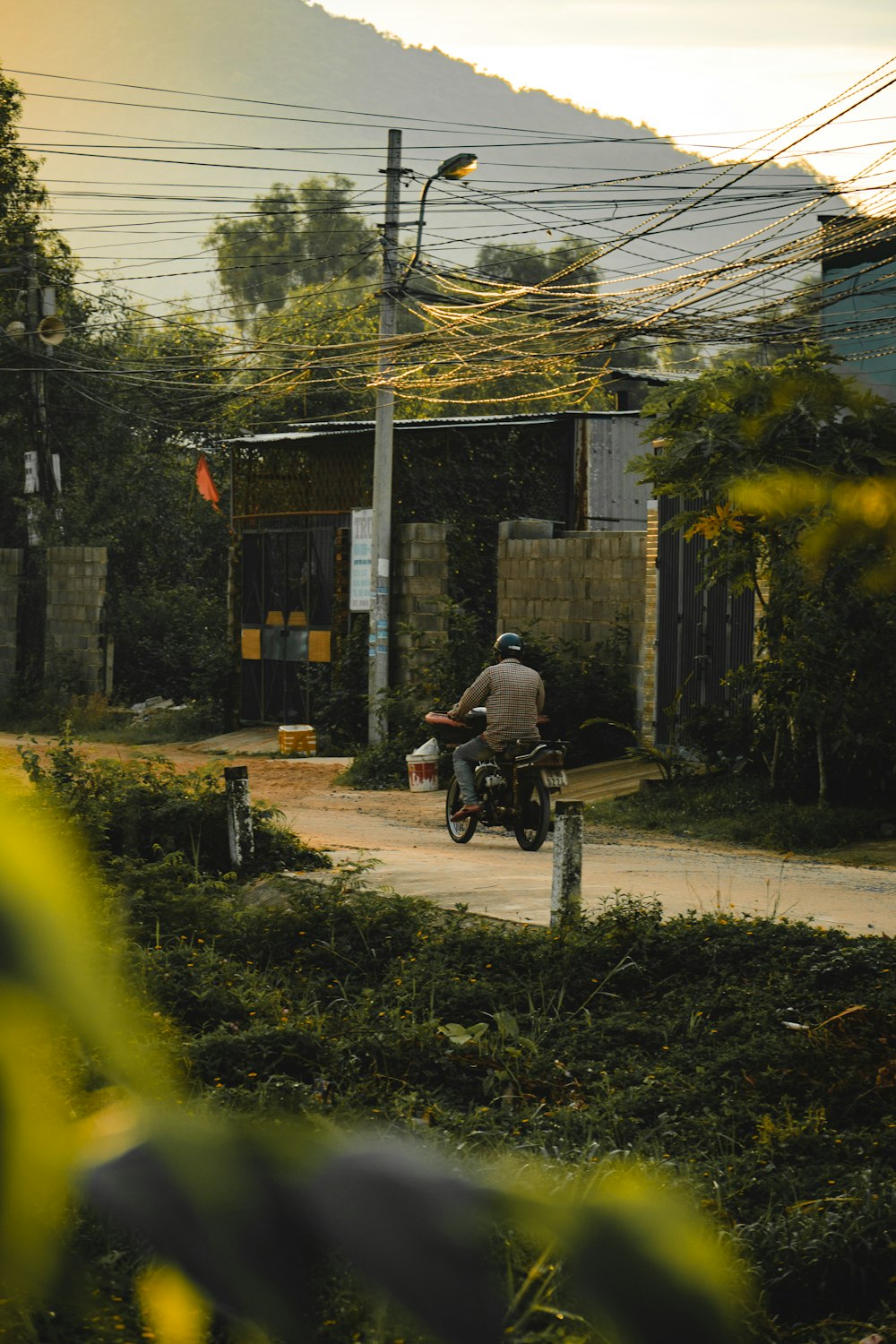 a man riding a motorcycle down a street