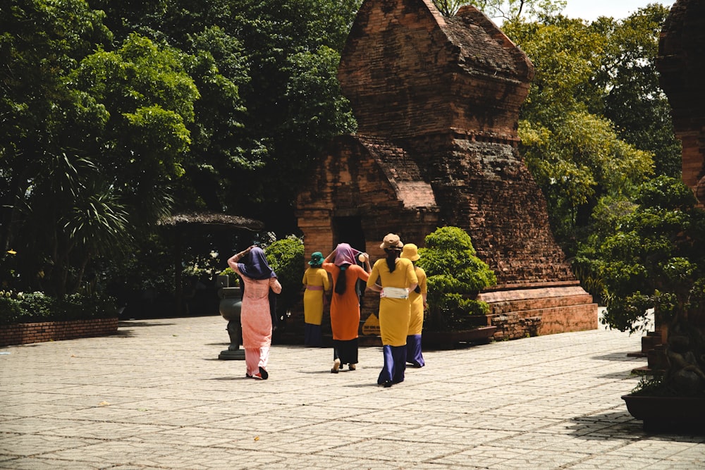 a group of people standing in front of a building