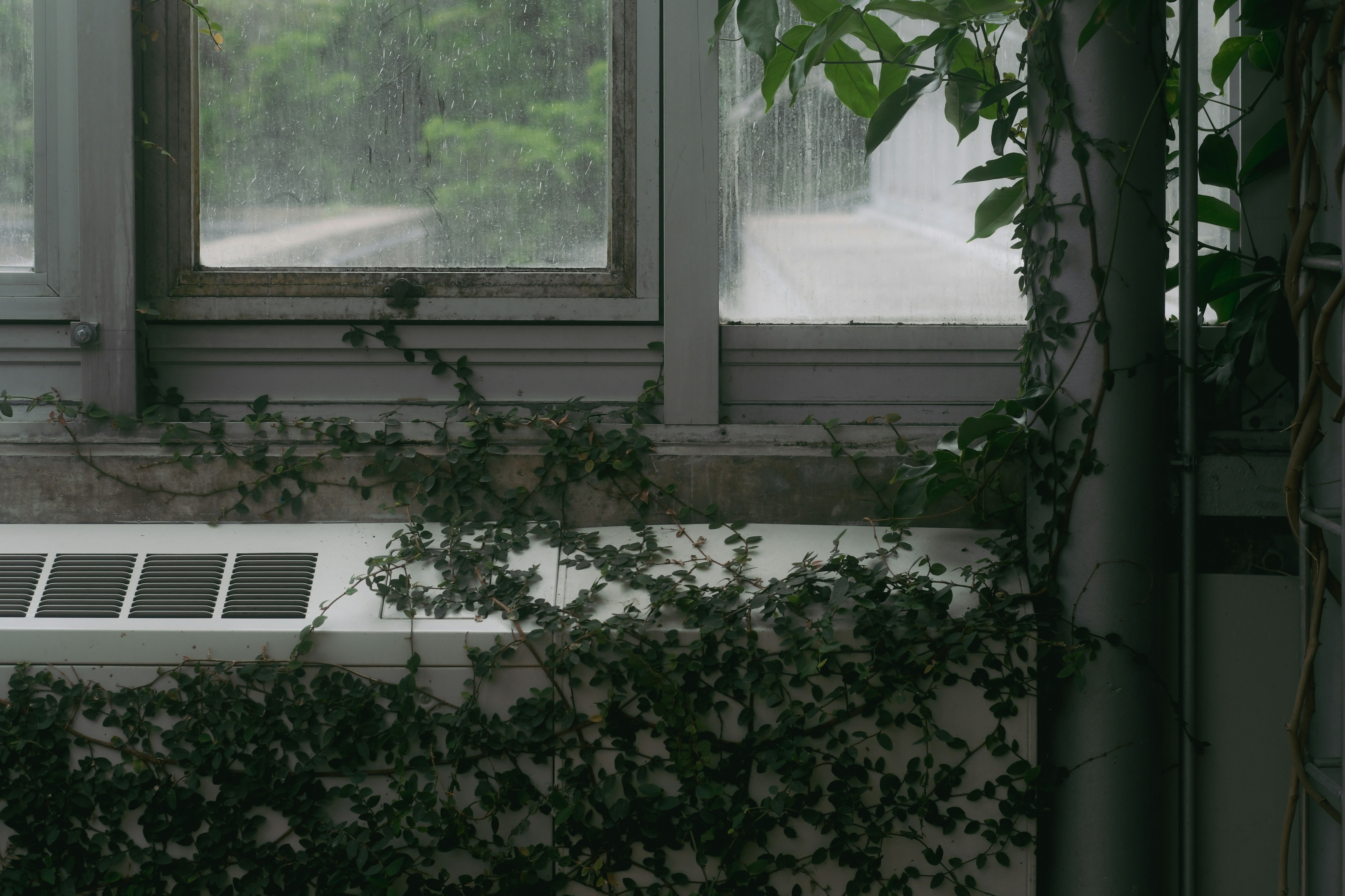 an air conditioner sitting in front of a window