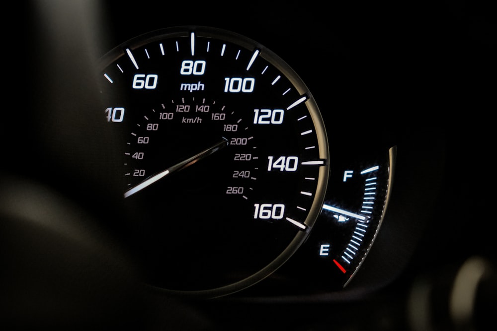 a close up of a speedometer in a car