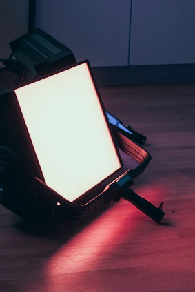 Bright LED panel lights illuminating a film set in a cozy indoor space