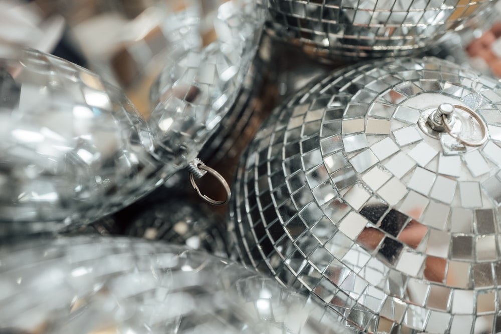 a bunch of shiny disco balls sitting on top of a table