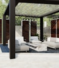 a white couch sitting under a wooden structure