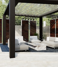 a white couch sitting under a wooden structure