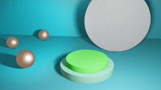 A minimalistic scene features spherical objects placed on a teal background. A prominent circular platform in shades of green is positioned in the foreground, while a large gray disc occupies the right side, casting a soft shadow.