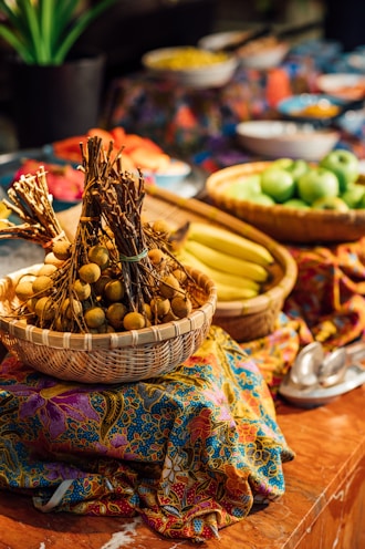 a wooden table topped with bowls of fruit