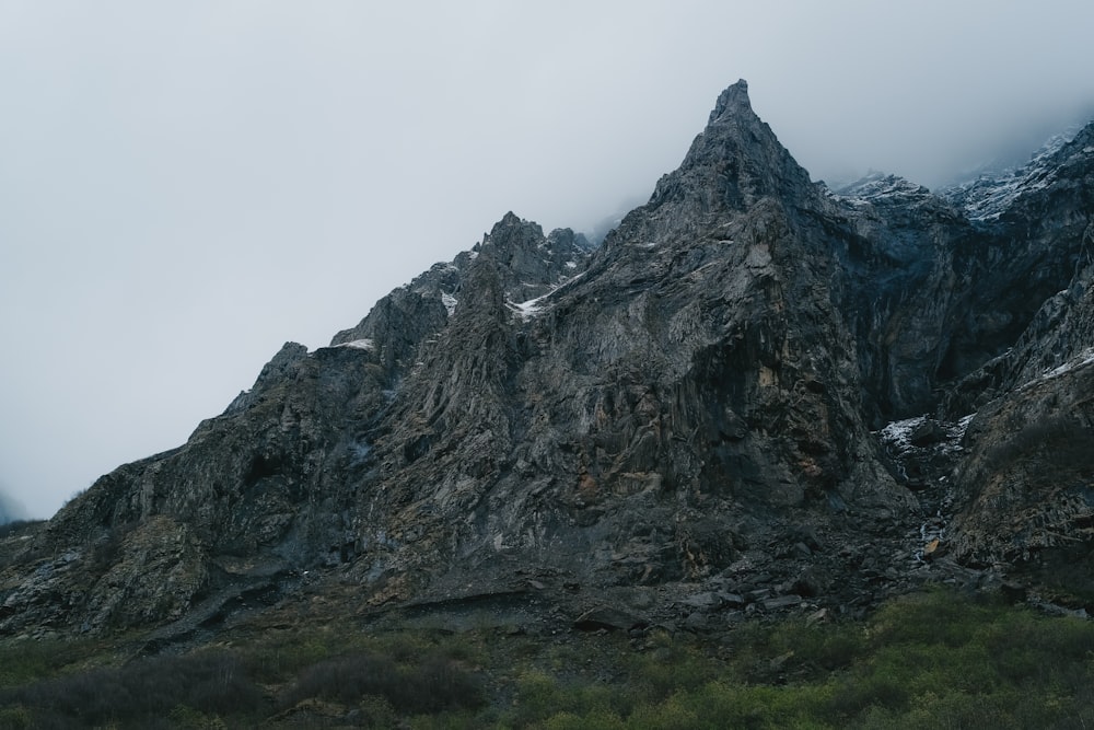 a very tall mountain with some snow on it