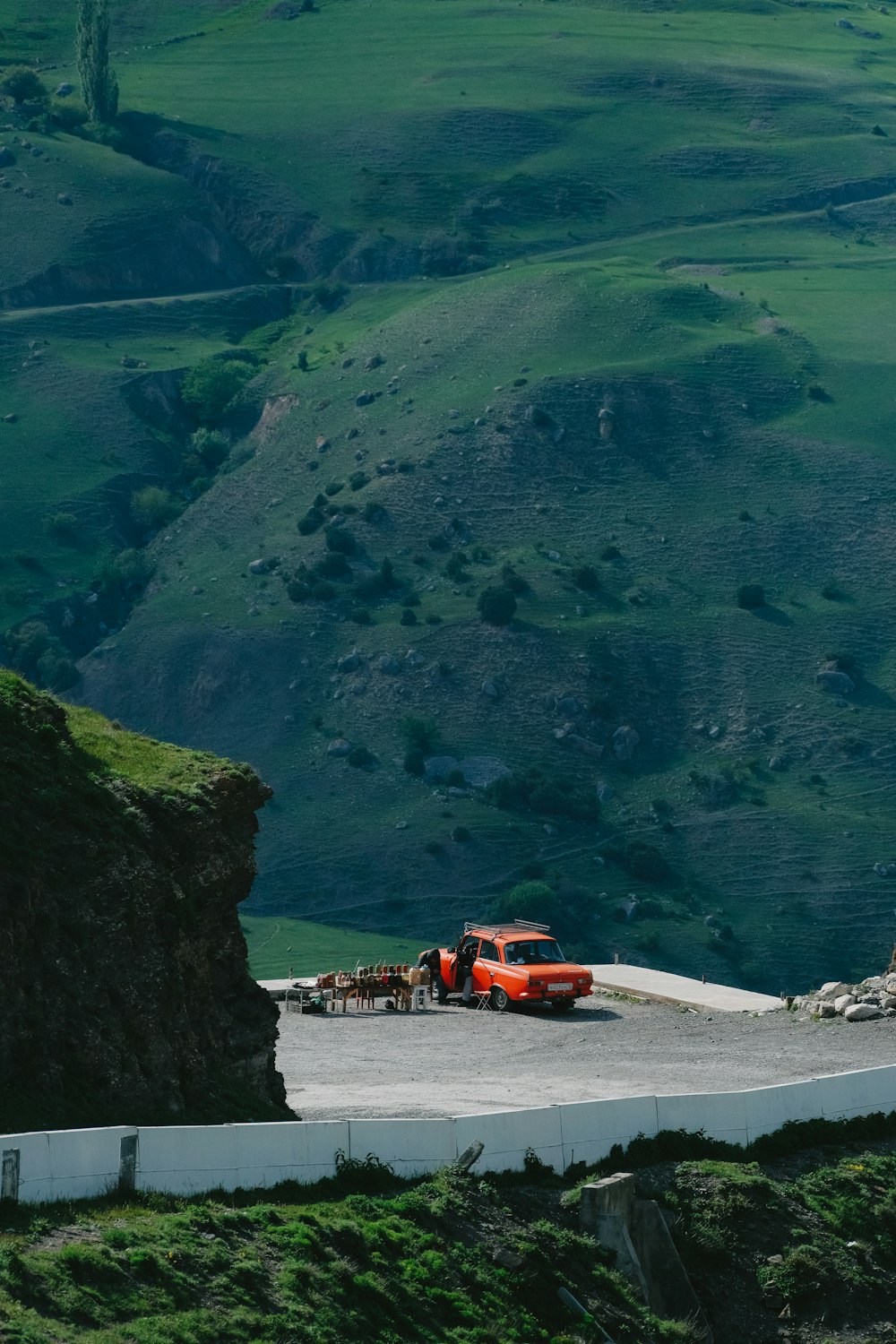 a red truck parked on the side of a road