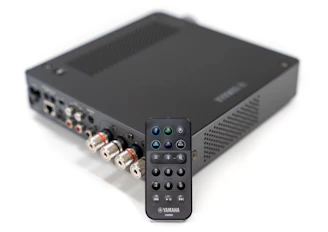 a remote control sitting on top of a black box