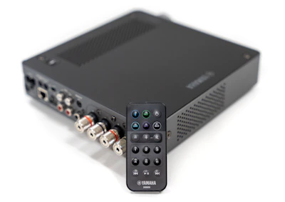 a remote control sitting on top of a black box