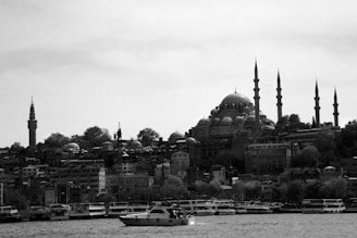 a black and white photo of a boat in the water