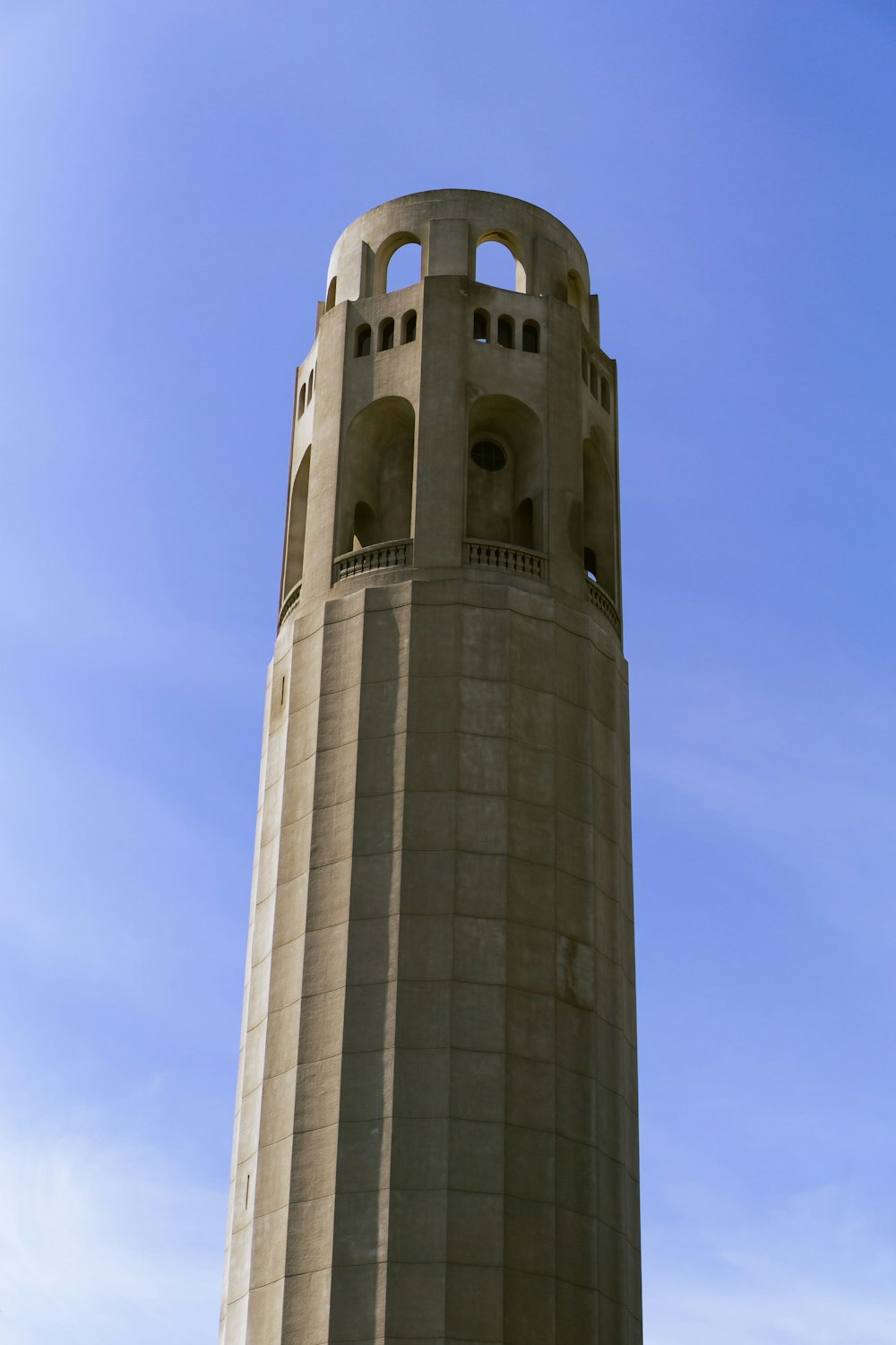 a tall tower with a clock on the top of it