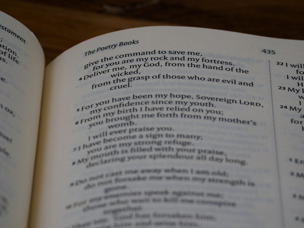 a close up of an open book on a table