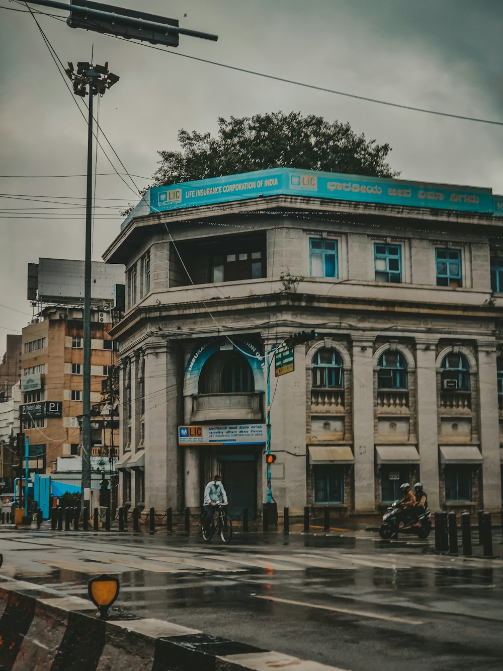 an old building with a blue sign on top of it