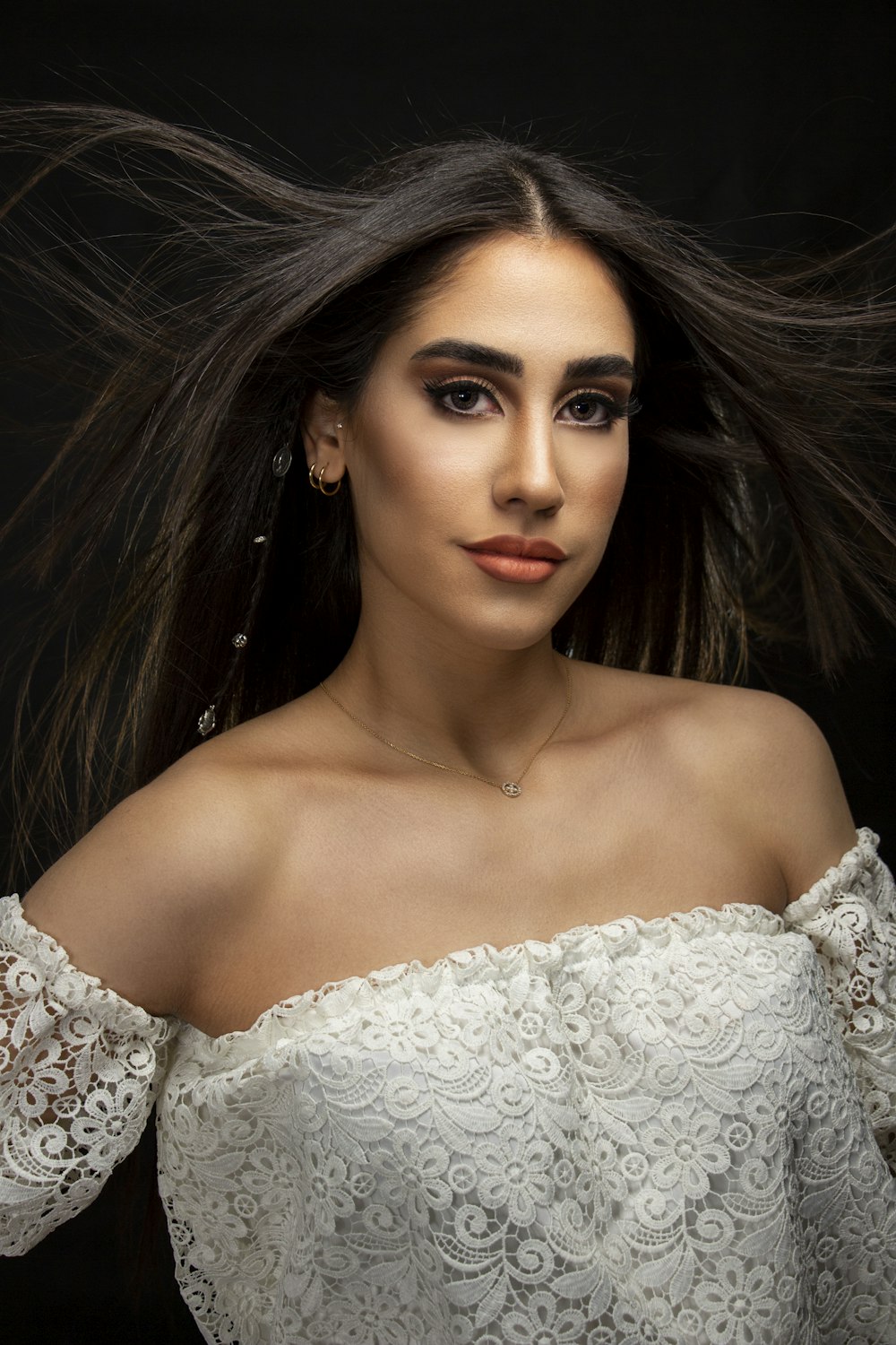 a woman with long hair in a white dress