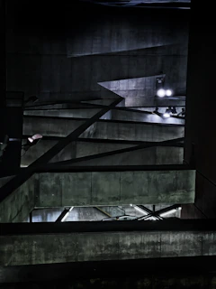 Ambient shot of the showroom’s brutalist concrete floor and exposed pipes with neon green highlights