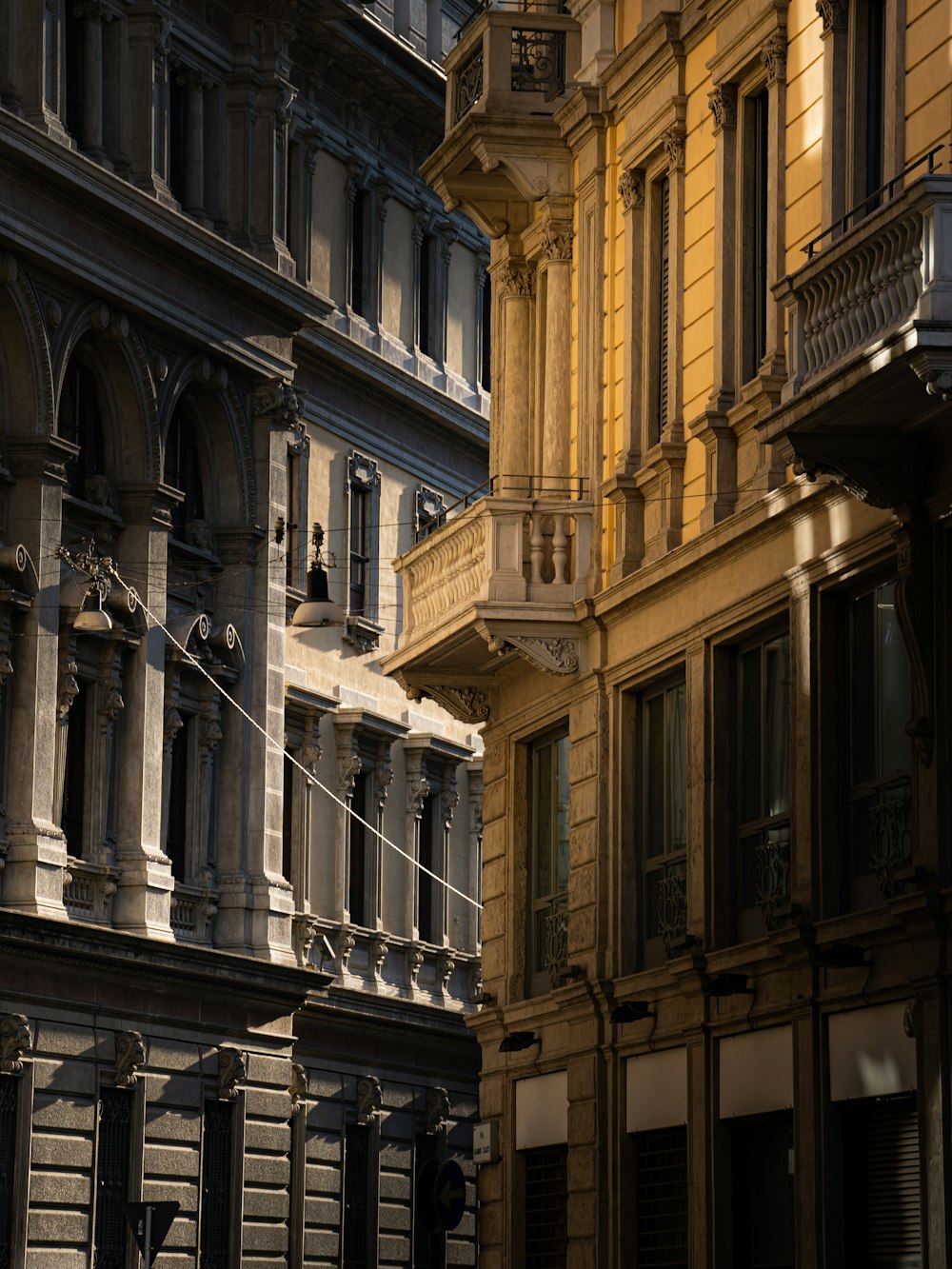 a row of buildings with a clock on each of them