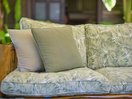 a couch with a bunch of pillows on top of it