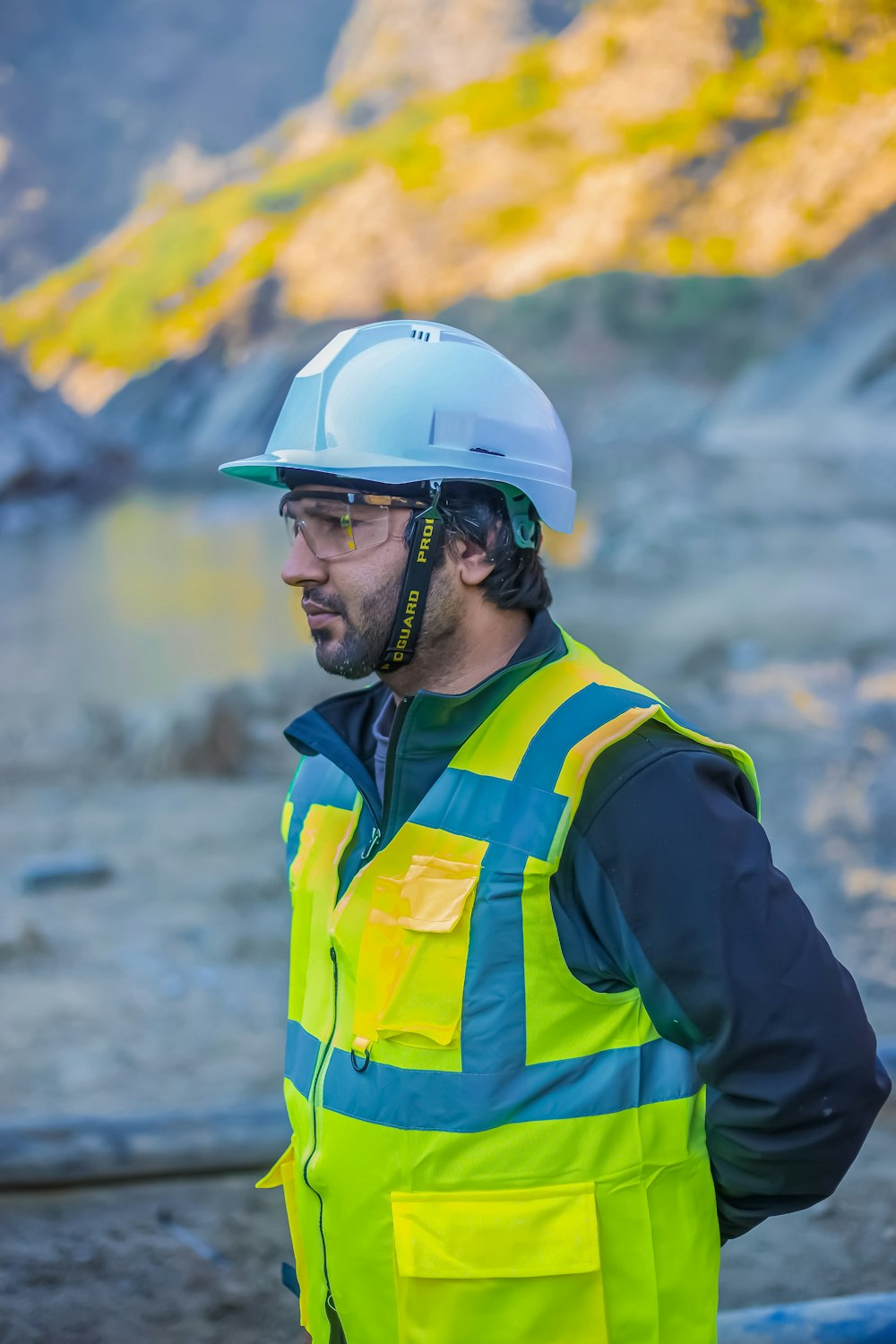 a man wearing a hard hat and safety vest