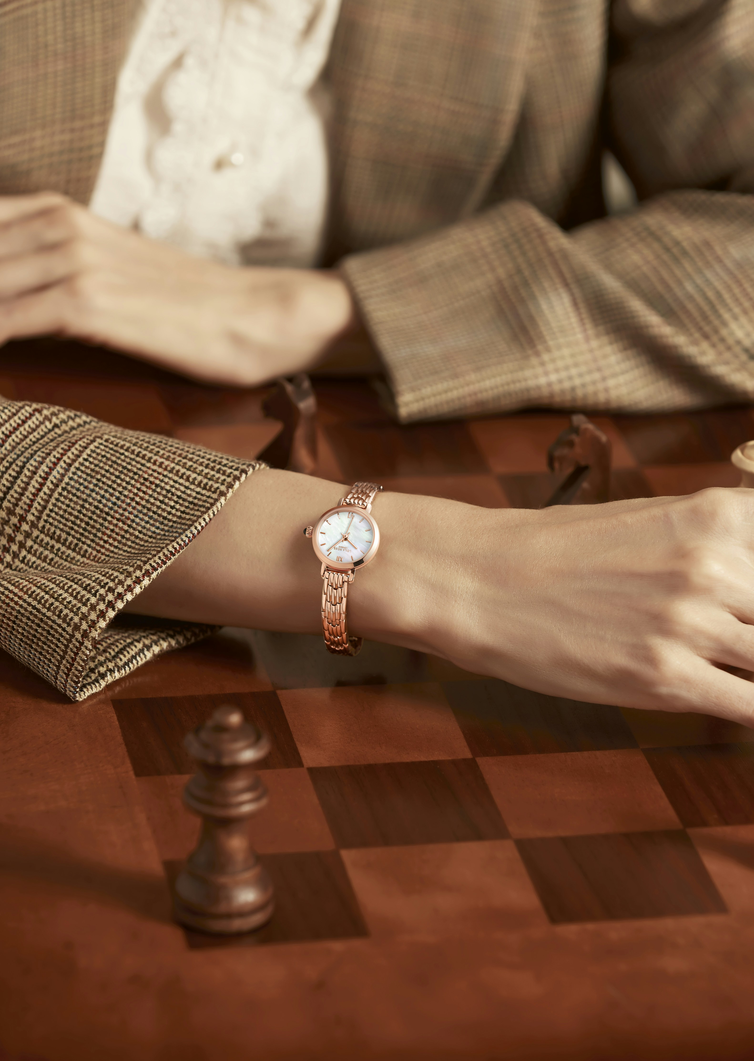 a woman's arm with a watch on it