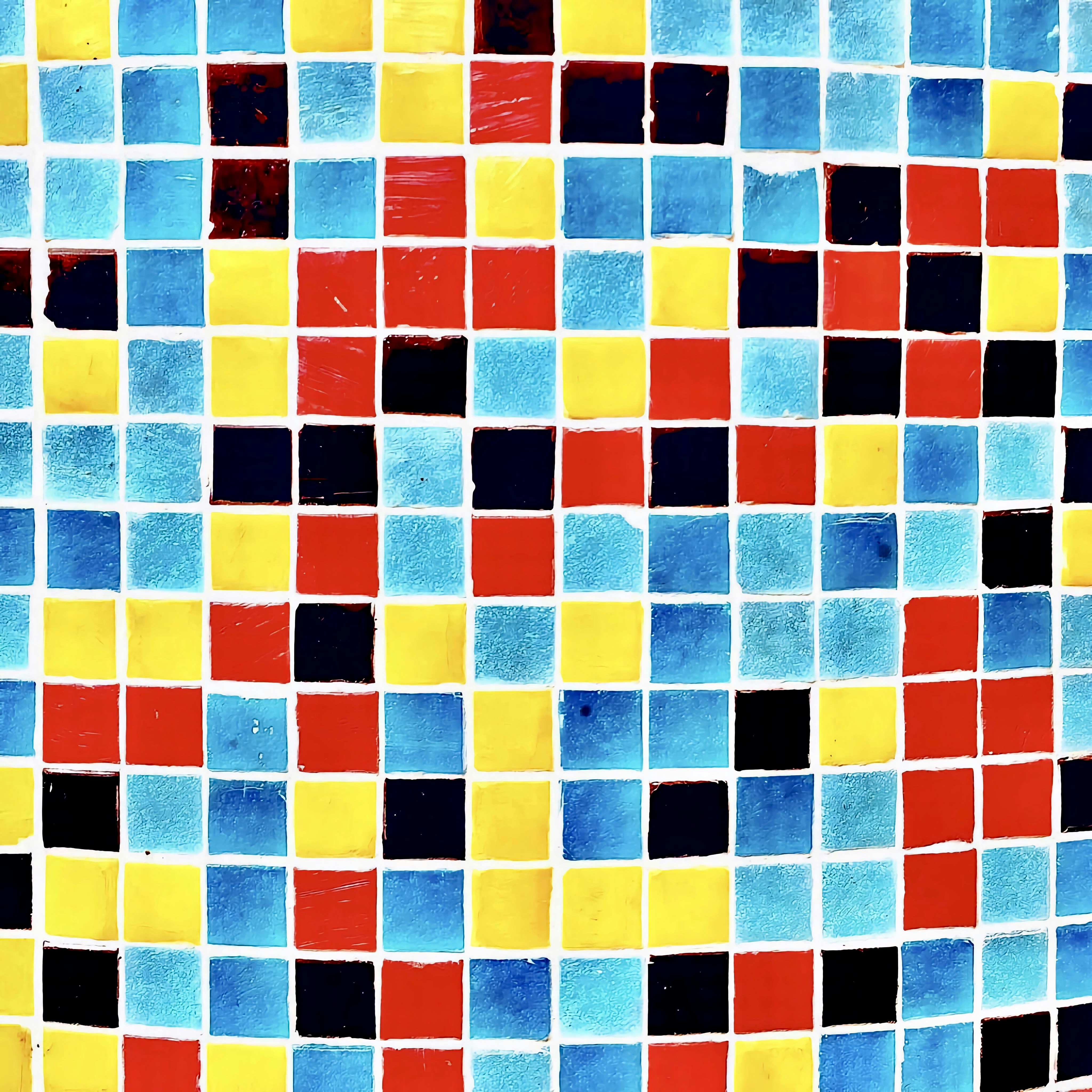 a multicolored tiled wall with a pattern of squares