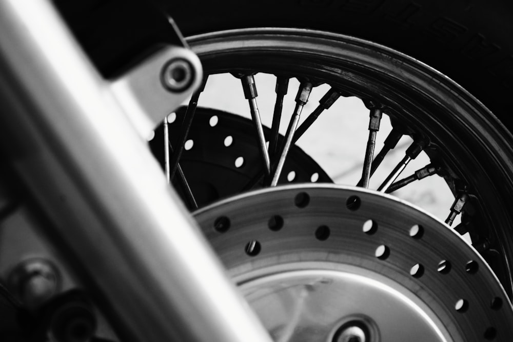 a close up of a motorcycle tire and spokes