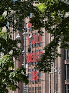 Bold metal lettering mounted on a building facade.
