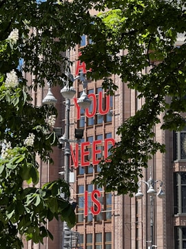 Bold metal lettering mounted on a building facade.