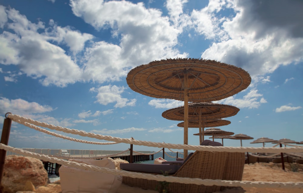 a bunch of umbrellas that are on a beach