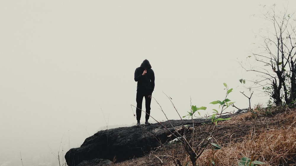 a person standing on top of a hill