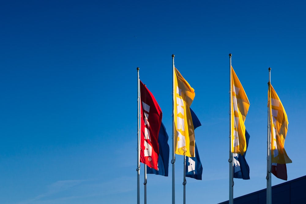 a group of flags flying in the wind