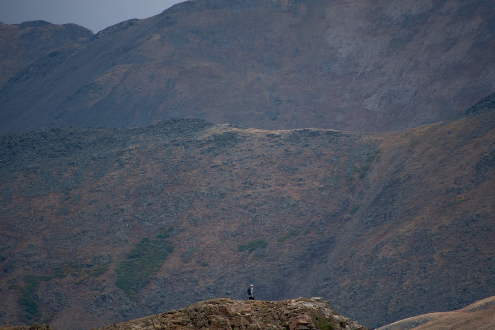 a person standing on top of a mountain