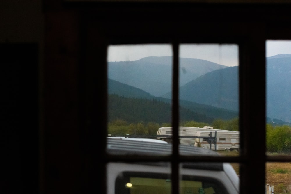 a view of a mountain range through a window