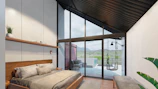 Luxurious bedroom with floor-to-ceiling windows framing the lush hillside scenery.